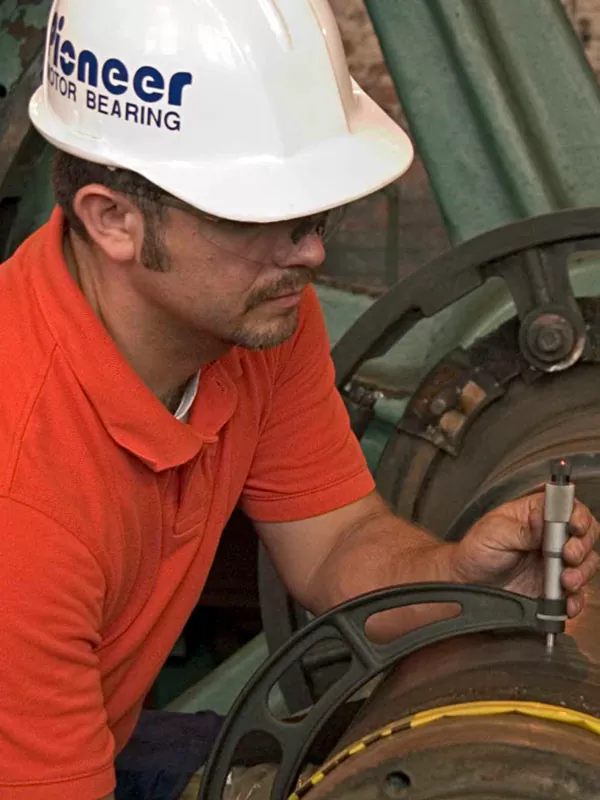 Pioneer engineer measuring the shaft fit diameter of a thrust block